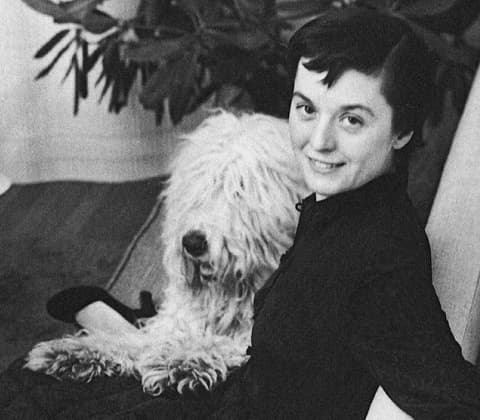 A portrait of Florence Knoll with her Old English Sheepdog Cartree